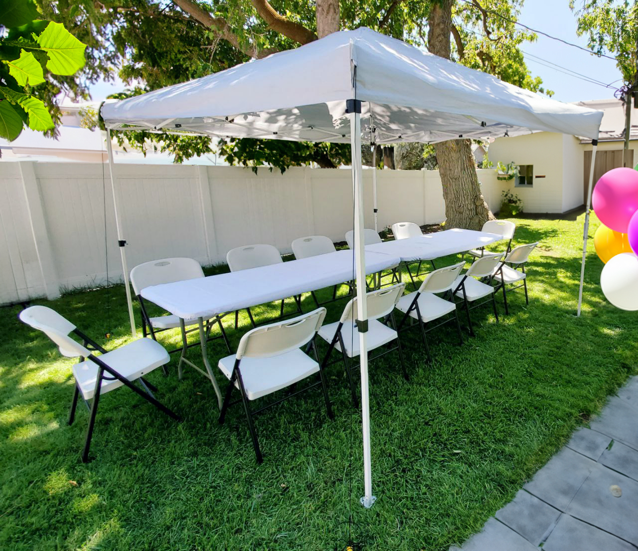 Photo of a party setup with tables and chairs
